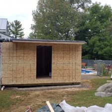Plywood sheathing installed on exterior walls of addition
