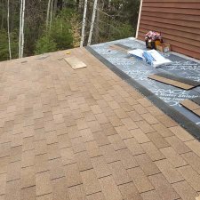 Asphalt shingle roof installation in progress